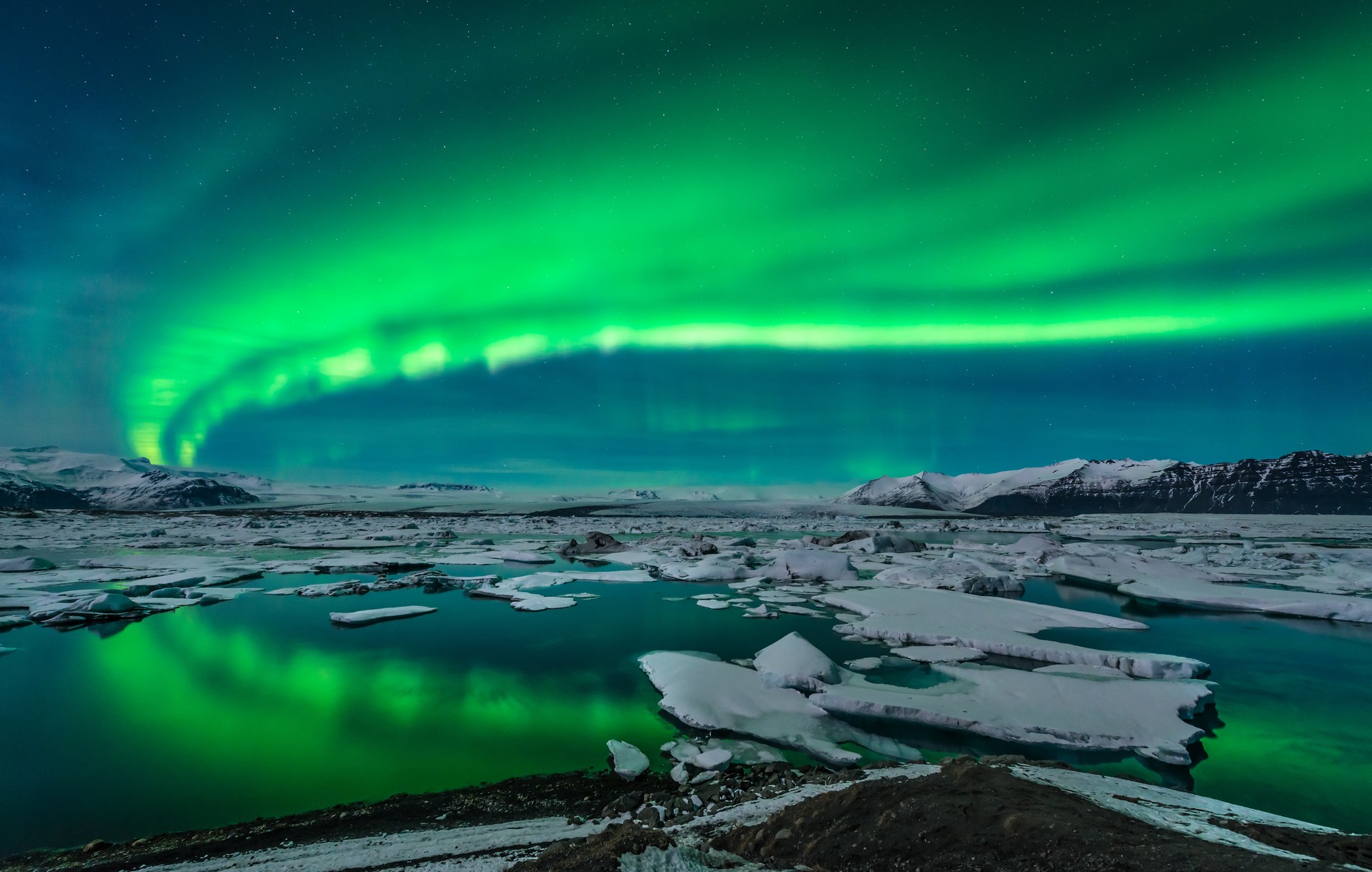 Aurora over Jokulsarlon, large glacial lagoon in southeast Iceland.